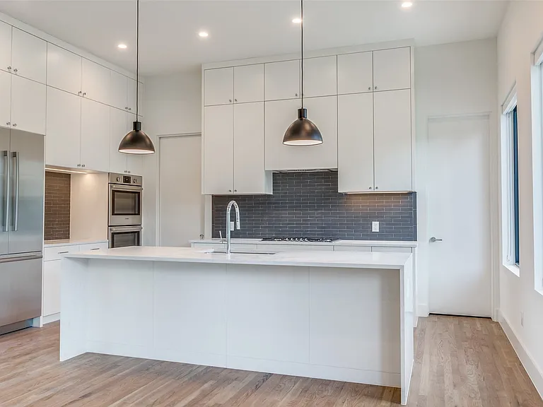 Sleek feel in this beautiful and efficent kitchen with a ton of cabinet space