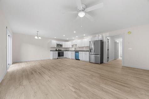 Nice, bright recessed lighting throughout with dining light and ceiling fan light