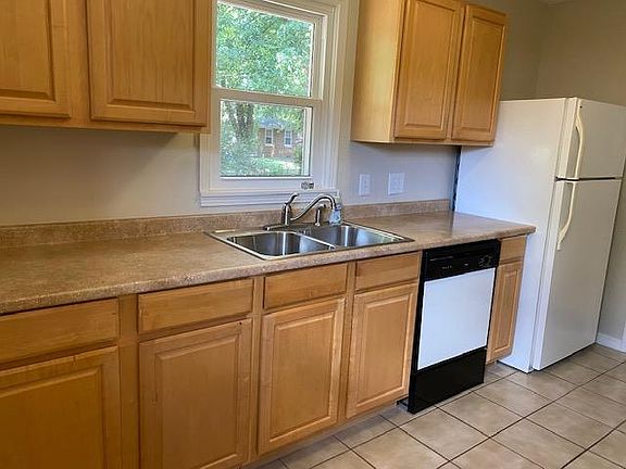 Kitchen includes refrigerator, dishwasher and garbage disposal.