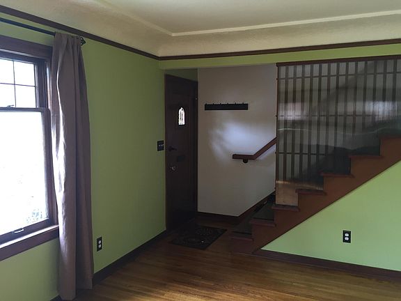 Front door and stairs to loft space