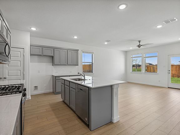 Kitchen in the Oak II home plan by Trophy Signature Homes - REPRESENTATIVE PHOTO