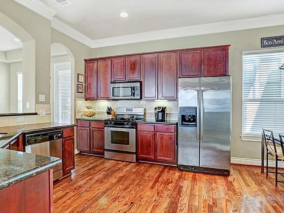 Kitchen with stainless steel appliances, fridge and all appliances stay!