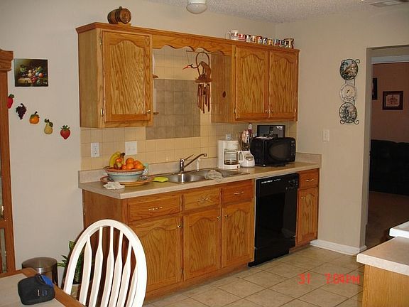 features New Tile Floor and Tile Backsplash