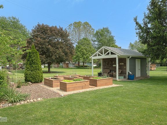 The raised garden beds are new this year, have a unique watering system and are fully planted! All y