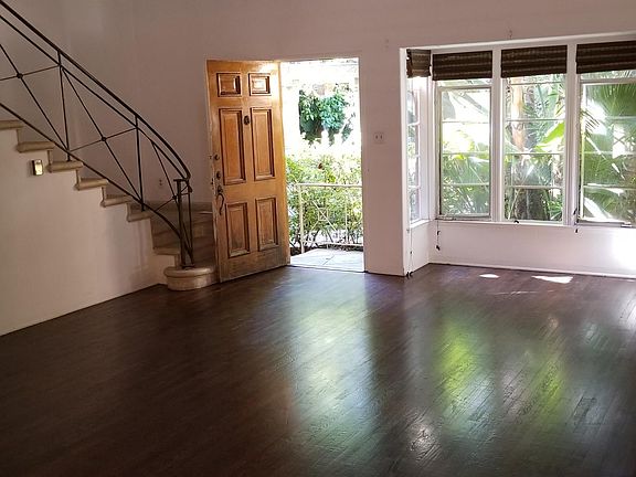 View from dining room toward front door and bay window