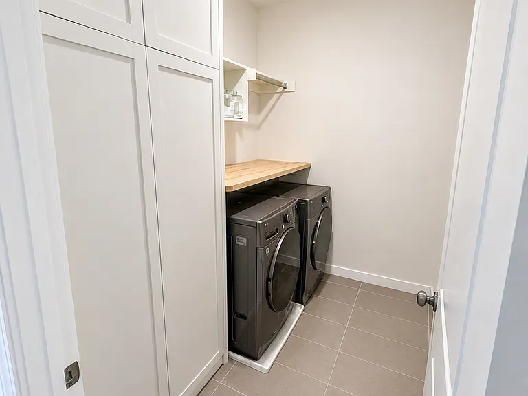 Laundry room, view from hallways outside bedrooms and across from full bathroom
