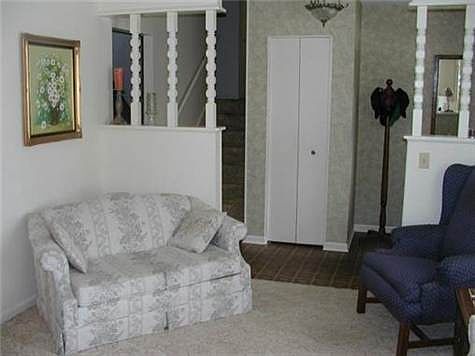 Living room looking into entryway.