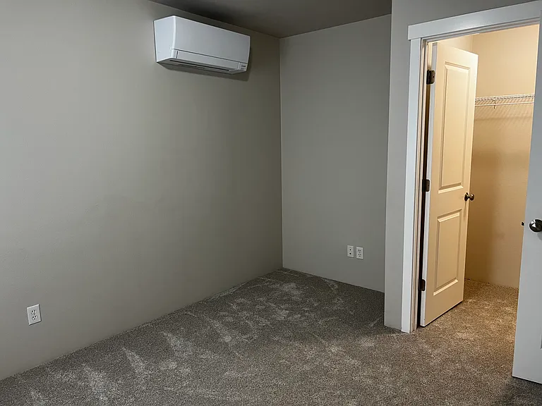 Guest or kids bedroom #2 view of the walk in closet and nook for a desk or tall dresser.