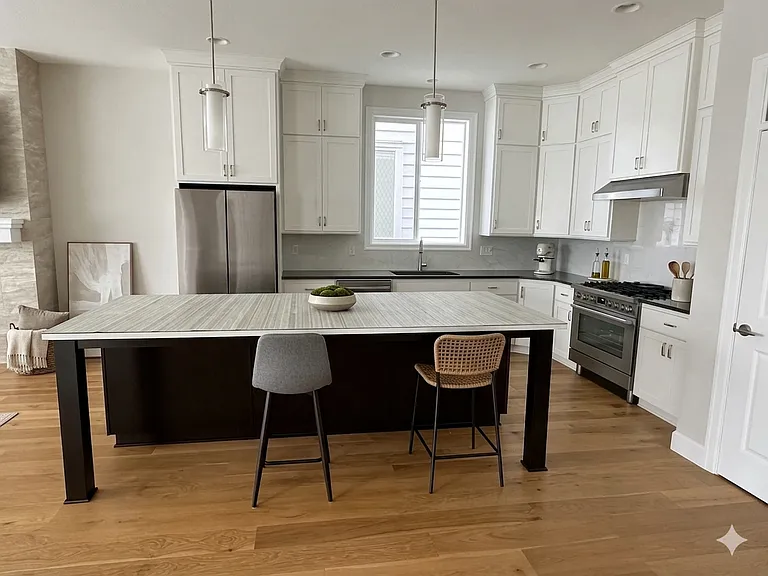 Island and Kitchen with kitchen cabinets till roof