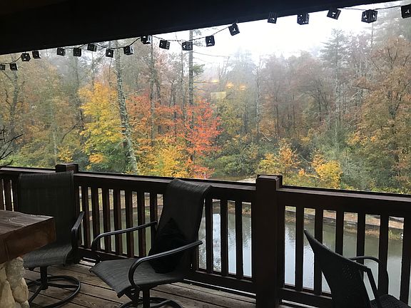 Beautiful mountain view with pond and a water fountain in front of the balcony. There's also a view of the horse pasture river from the balcony.