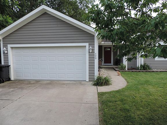 2-car garage, small shaded front porch