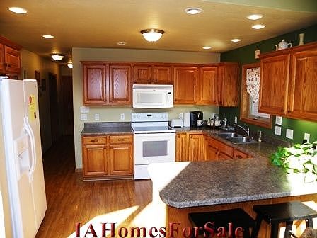 Kitchen is U-shaped and designed for efficiency. Has plenty of space in the oak cabinets including two lazy susans.