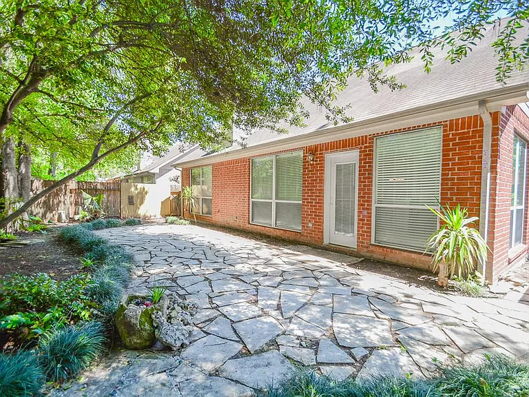 Backyard with paved stones and surreal garden