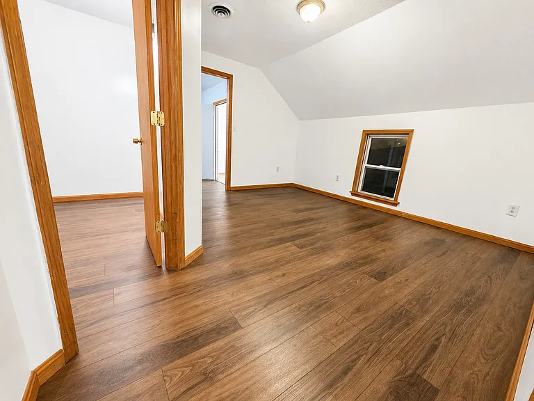 Bright living room with updated flooring and clean neutral walls