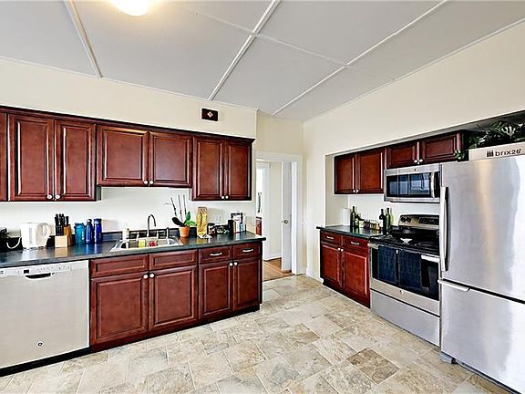 Kitchen with stainless appliances and ample of cabinet storage.
