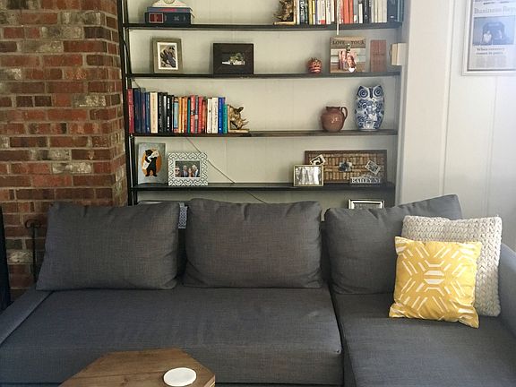 Built-in bookshelf; (bay window on right)