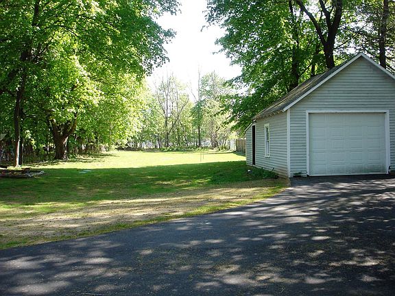 Large back yard with a detached garage