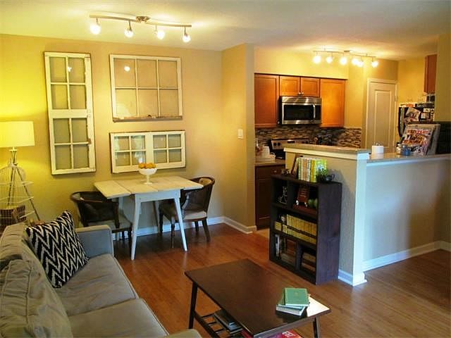 Beautiful bamboo floors, light fixtures, open floorplan