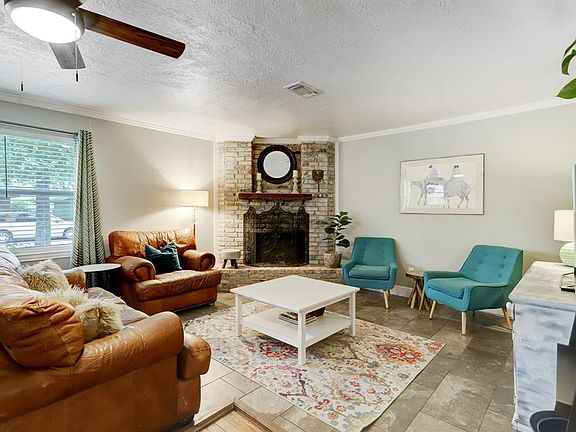 The living room can host an array of gatherings. Imagine roasting marsh-mellows in the wood burning fireplace.