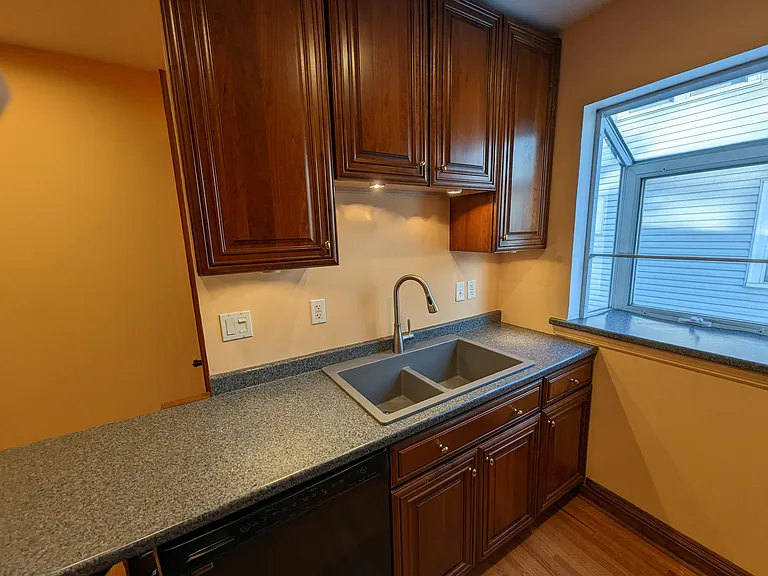Sink and garden window. Lower cabinets have pull out drawers for ease of getting pots and pans. refrigerator has automatic ice and filtered water (not needed though)