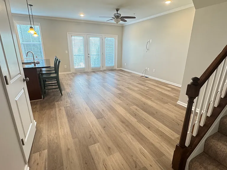 Second floor with kitchen, living area and half bath