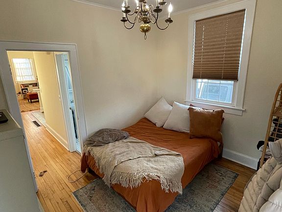 Bedroom which is in the back of the apartment which has a door to the deck