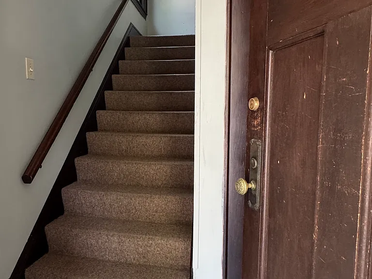 Apt 3 is on the Second Floor of this Triplex Building