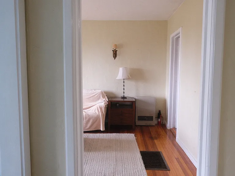view to the living room to the hall way. Bedroom is to the left