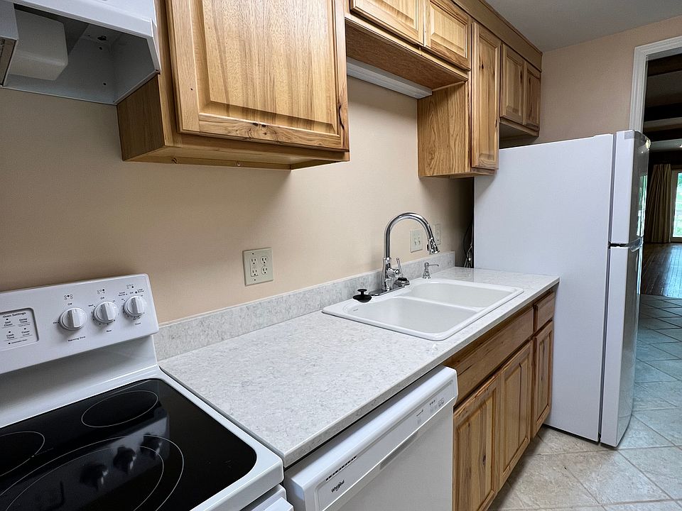 Remodeled kitchen with recently purchased appliances and quartz countertops