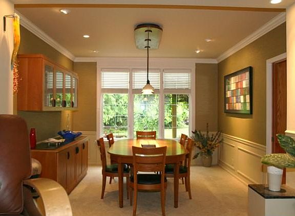 The formal dining room has views into the landscaped back yard. The dining room and kitchen/family r
