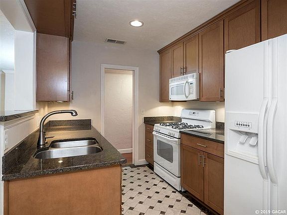 Remodeled Kitchen with gas stove, microwave, dishwasher, ref/frzr, custom cabinetry, granite countertops, etc.