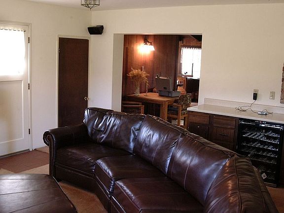 In the family room, bar to the right , door to pantry straight ahead