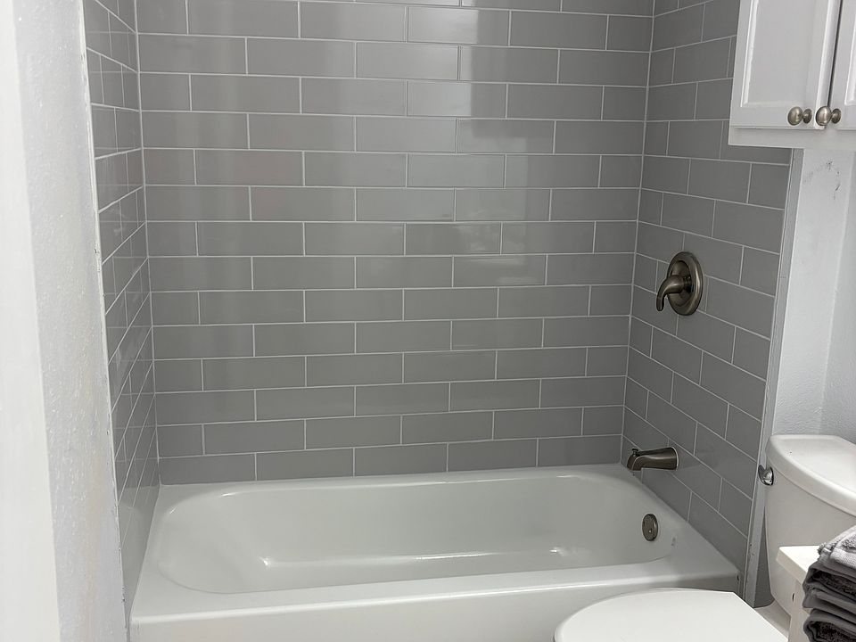 Brand new tub and tile surround.