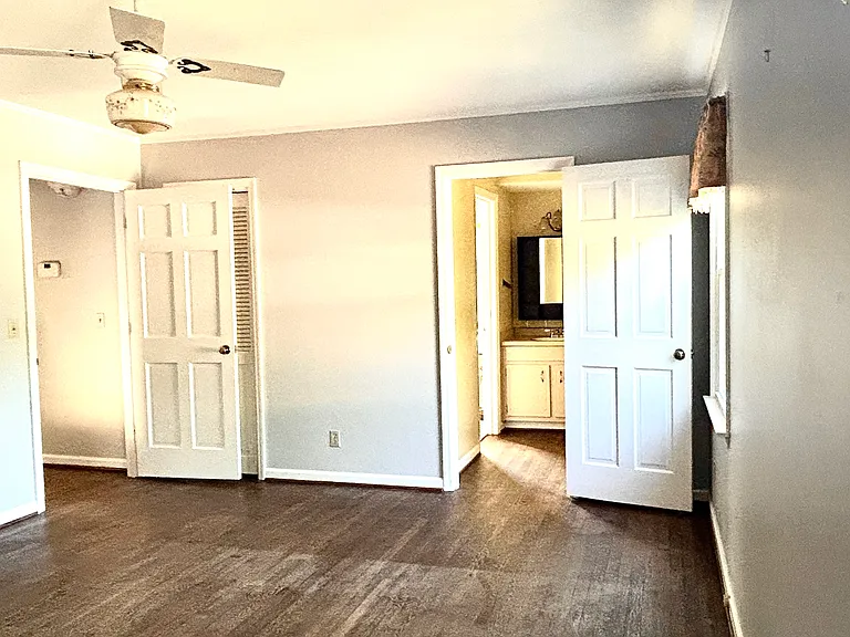 The other view of the upstairs master bedroom with its own closets, and bathroom and shower.