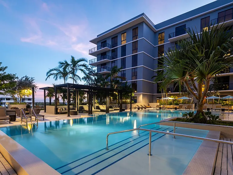 Resort-style pool with sundeck and cabanas