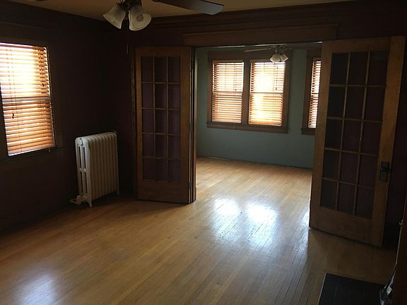 Living Room Looking South to Sunroom - Fireplace on the Righ