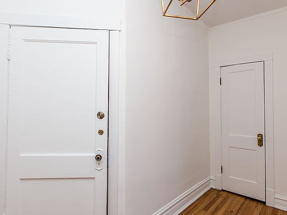 Foyer with a walk-in closet