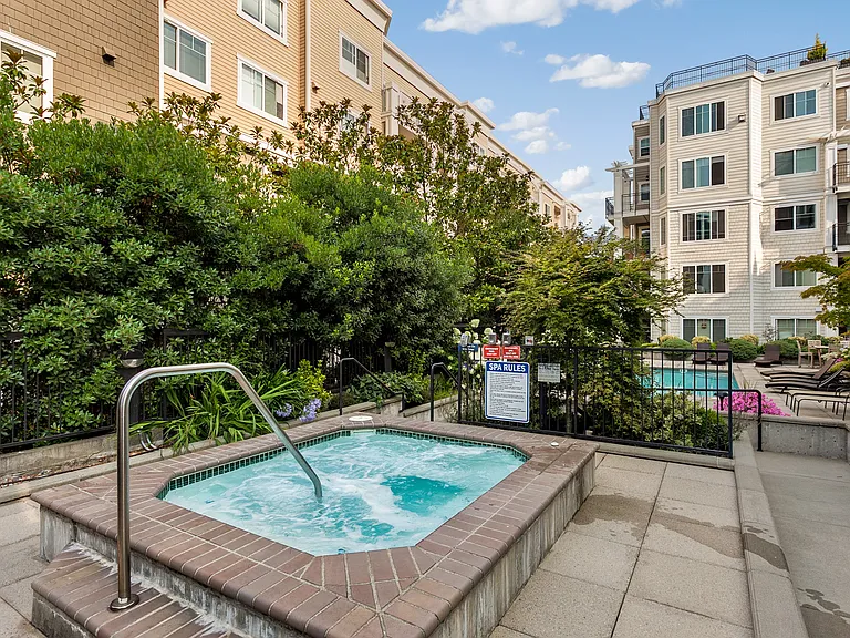 2nd floor pool terrace with grills, Ballard's only outdoor heated pool, and hot tub.