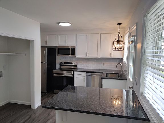 New kitchen cabinets, appliances and granite. The island has room for 2 bar stools