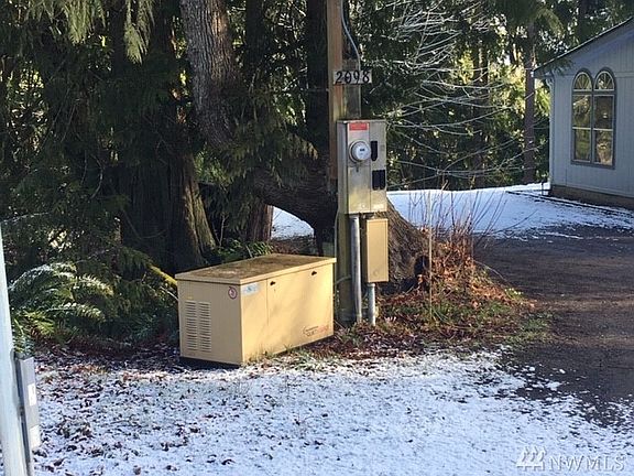 Emergency propane generator just inside gate/fence.