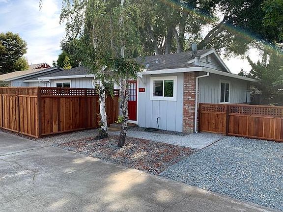Front door. Patio on the left and small yard to the right. Parking to the right also or in front of the garage.