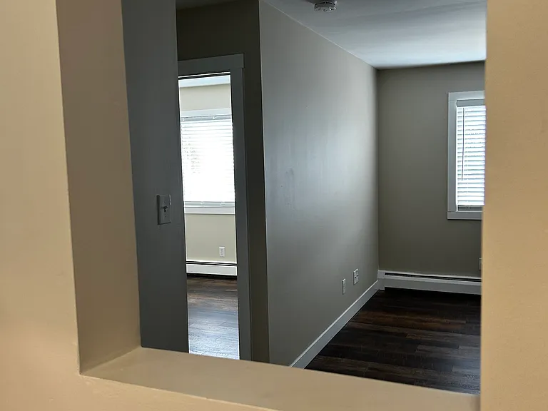 View of front bedroom from stove - Pre Tile Installation