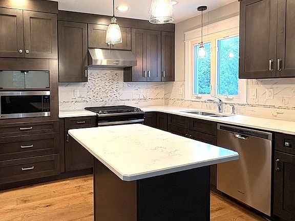 Kitchen sink facing a beautiful backyard