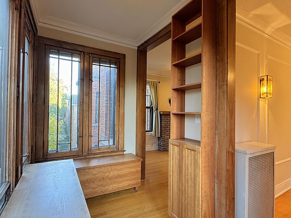 Sunroom/office w/ custom furniture & built-in cabinet!