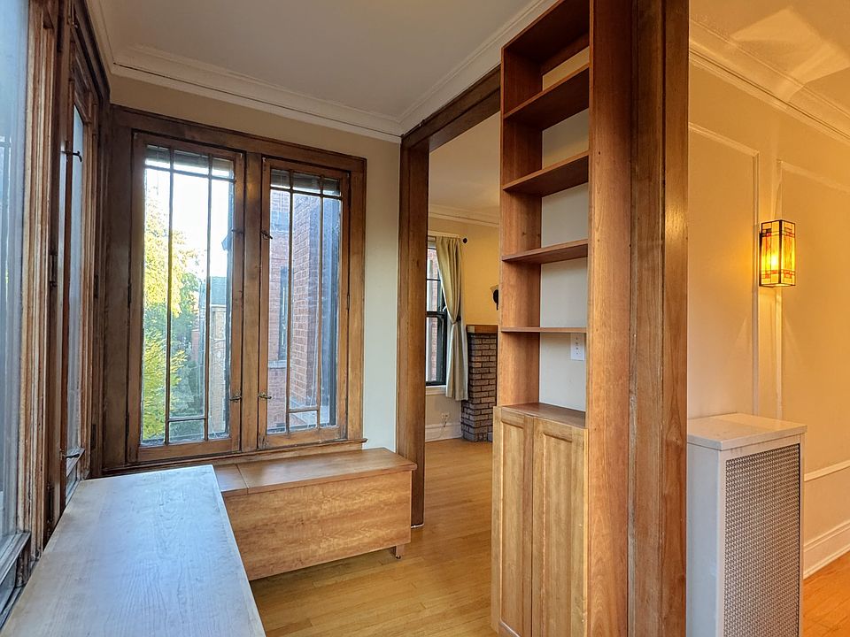 Sunroom/office w/ custom furniture & built-in cabinet!