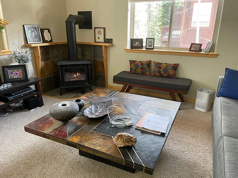 Cozy little gas stove with remote so there is no jumping up and down to turn it on and off. Secondary heating source.