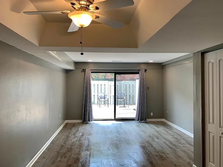 Living room with pantry and half bath on the right side of room.