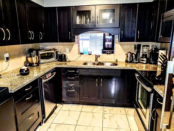 Kitchen with Granite Countertops and Stainless steel Appliances