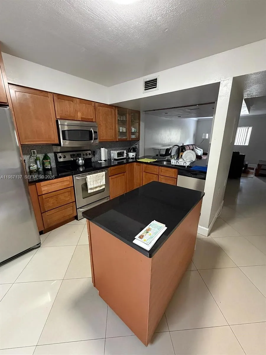 Building Photo - 8240 SW 149th Ct #7-202