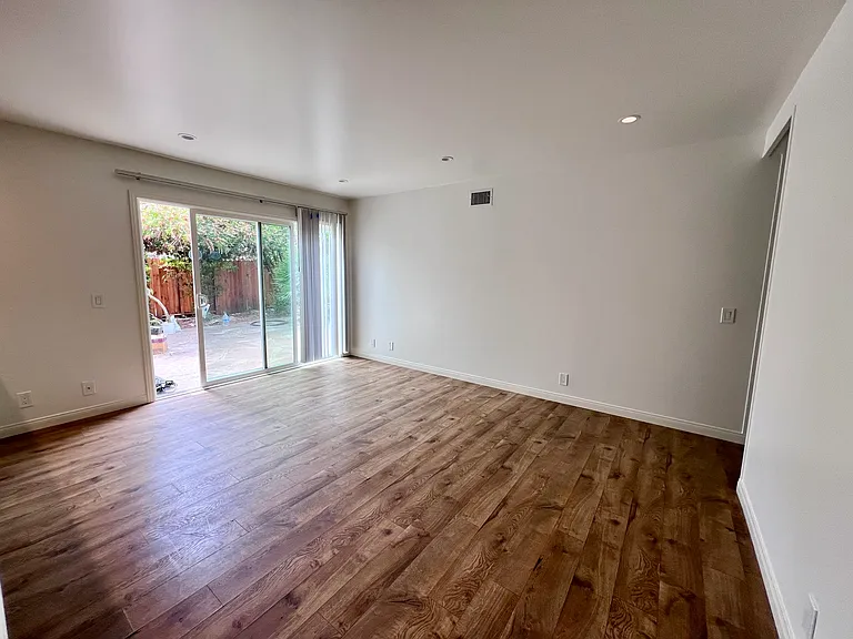 Living room showing patio with sliding doors.